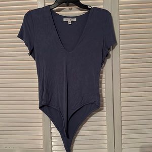 Blue bodysuit.  Short sleeve.  Bought from Candy Closet Boutique